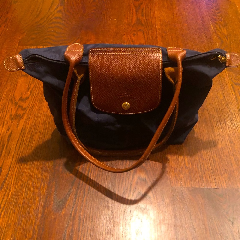 Medium sized, navy long champ purse with brown leather shoulder straps